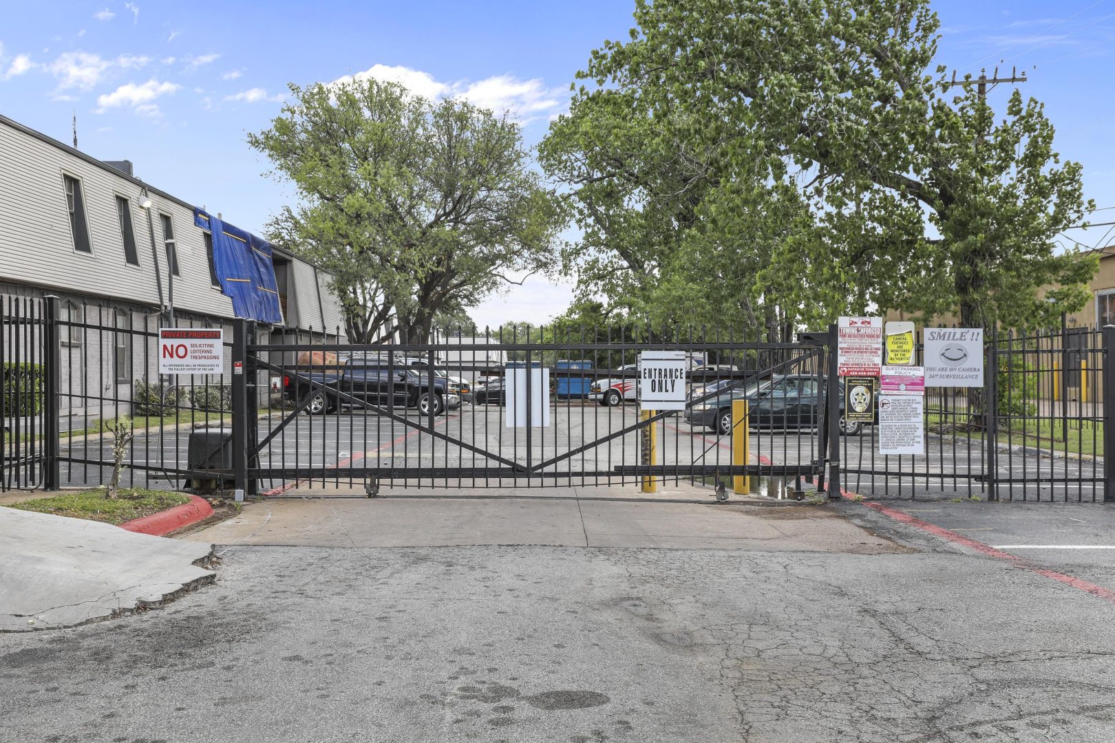 a gate with a sign that says, gate and a fence at The Flats on Handley