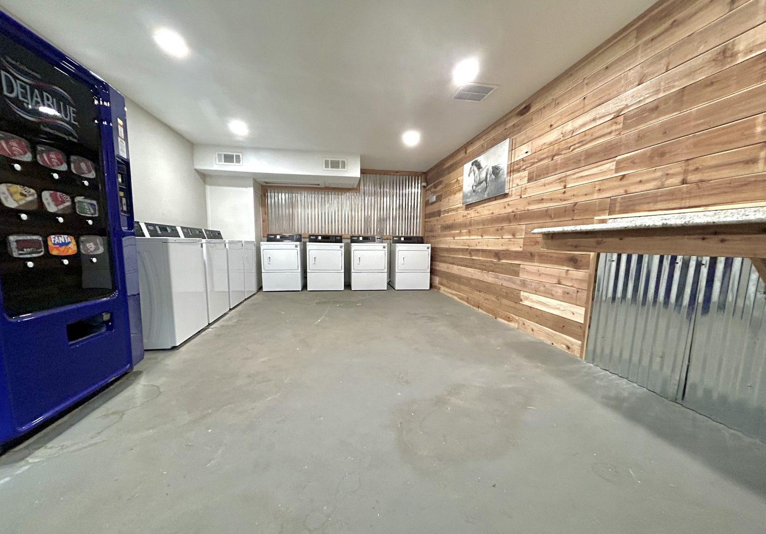 a laundry room with a washer and dryer at The Flats on Handley